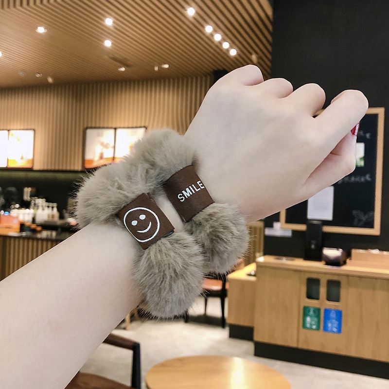 Cột tóc lông mặt cười