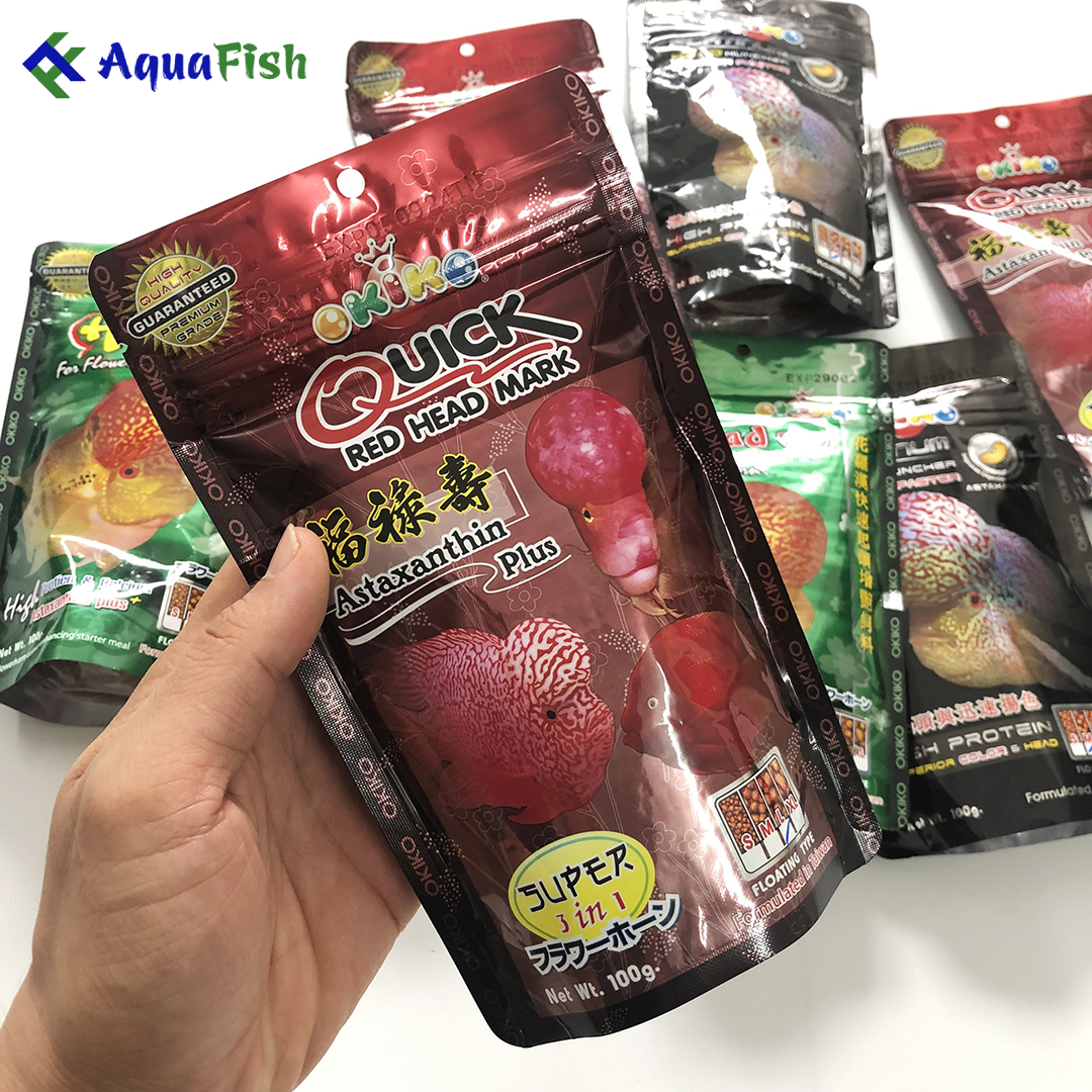 Thức ăn cho cá La Hán Okiko 100g giúp cá nhanh lớn, phát triển đầu và lên màu sắc đẹp