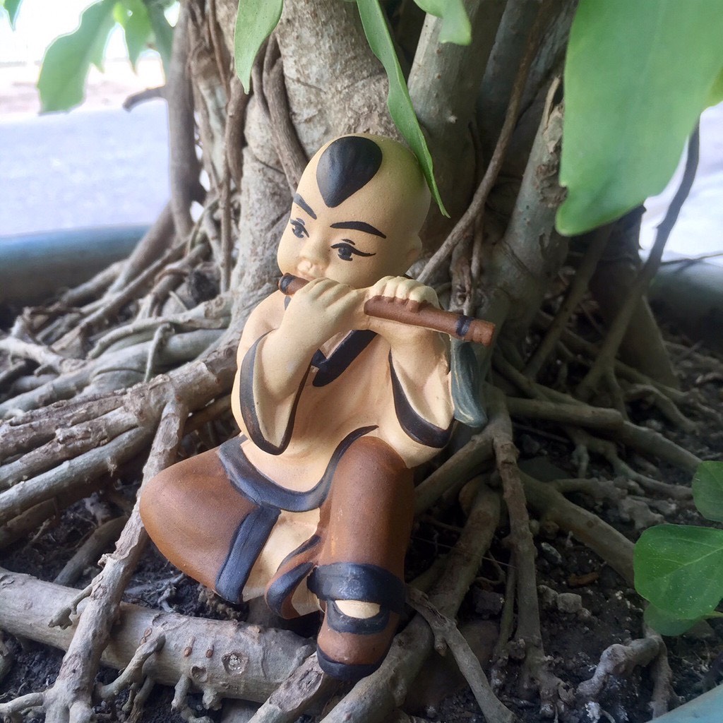 Cậu bé thổi sáo trang trí hồ cá bể cá-hòn non bộ..