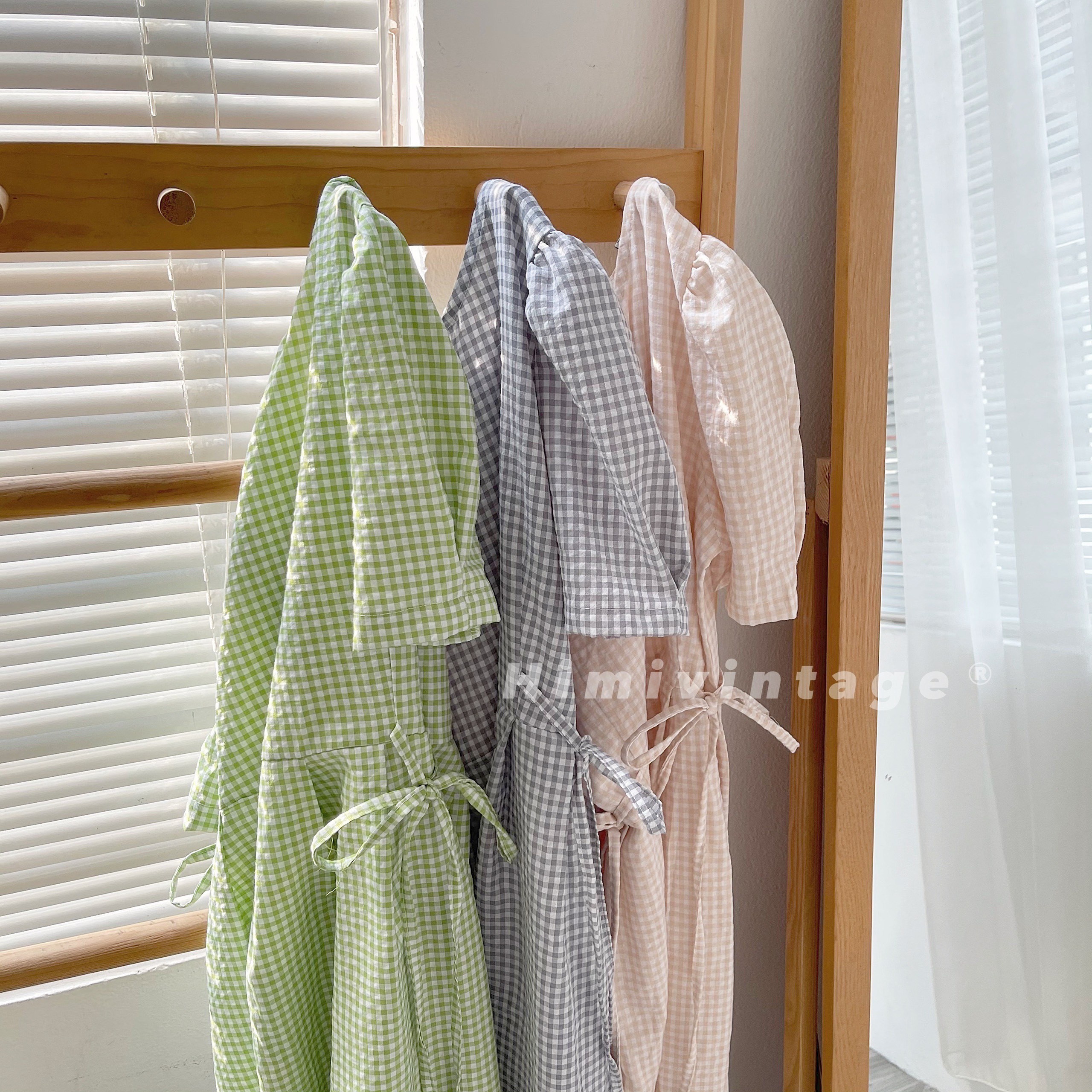 Đầm caro babydoll dây thắt nơ eo