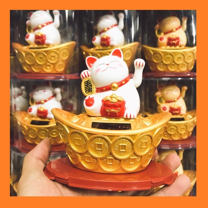Mèo Ngoắc Ngồi Thỏi Vàng