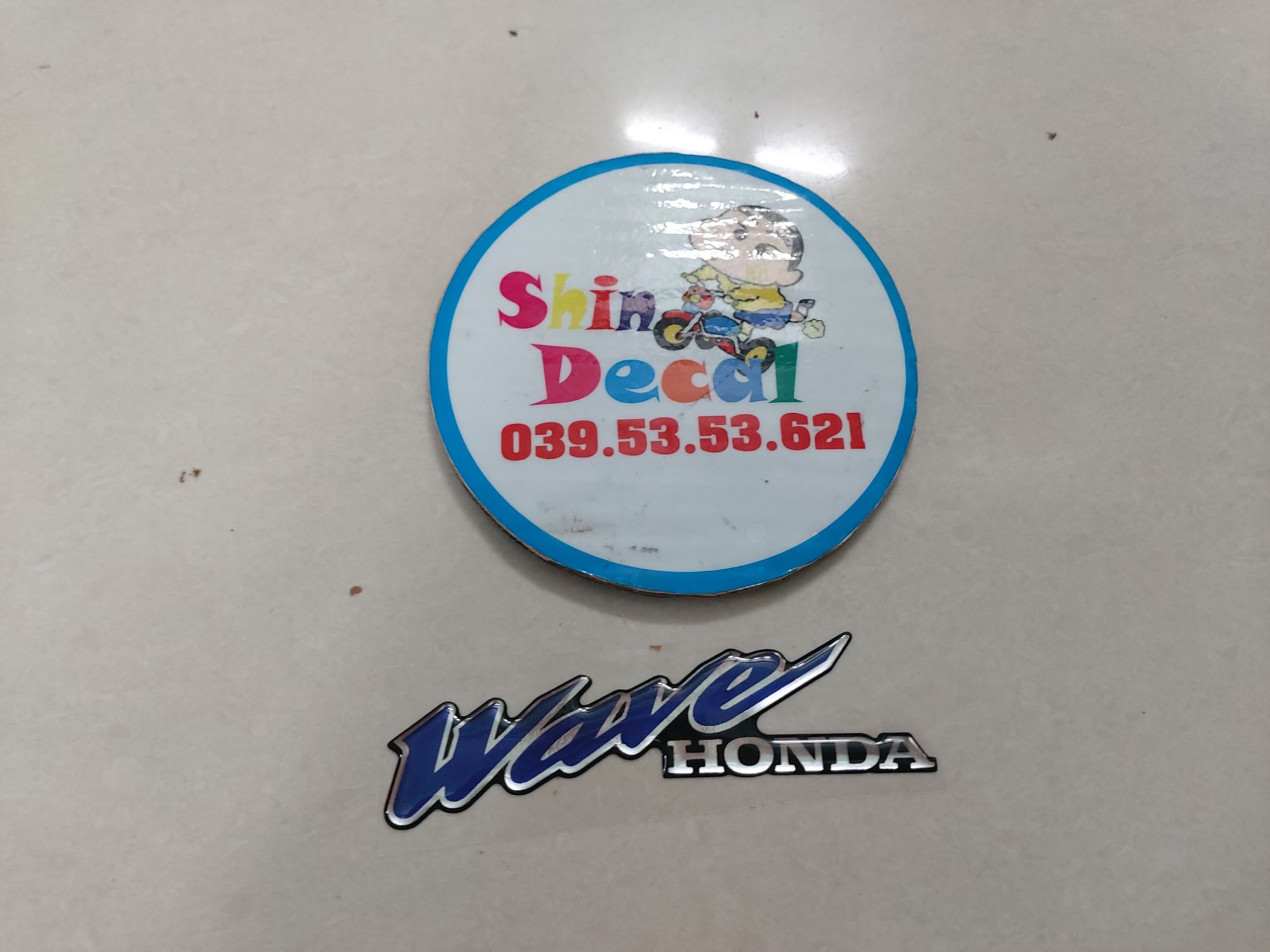 Tem chữ wave nhựa nổi dán mặt nạ
