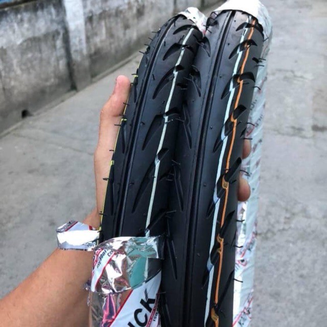Vỏ xe quick gr390 thái lan chính hãng xe số " có ruột " bao bám đường