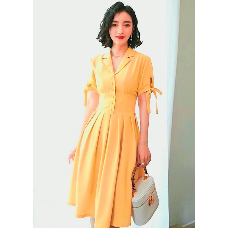 Đầm sm vàng nghệ nút bọc