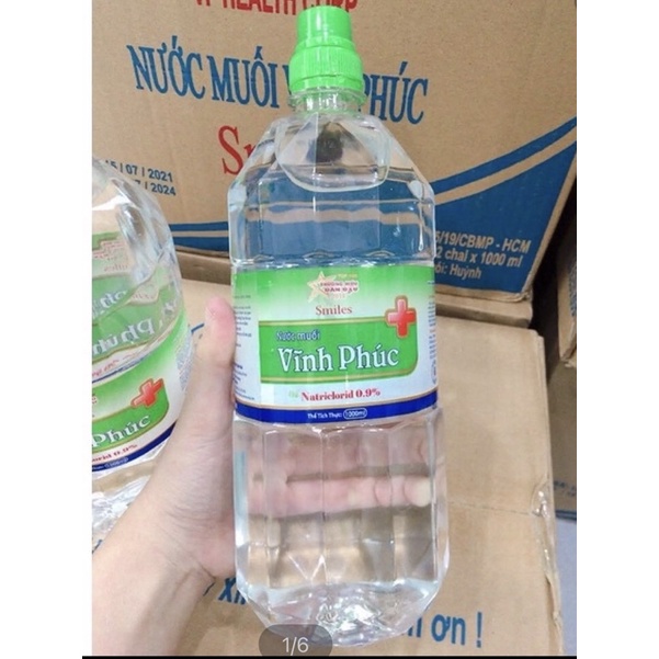 Nước muối sinh lý vĩnh phúc 0,9% chai 500-1000ml - nước muối súc miệng