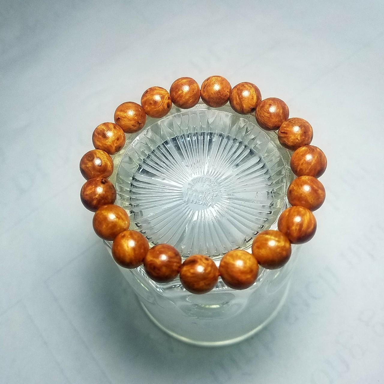VÒNG TAY GỖ NU HUYẾT LONG 14LY