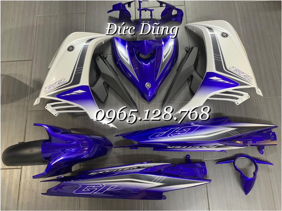 Dàn áo ex 135 trắng xanh 2011