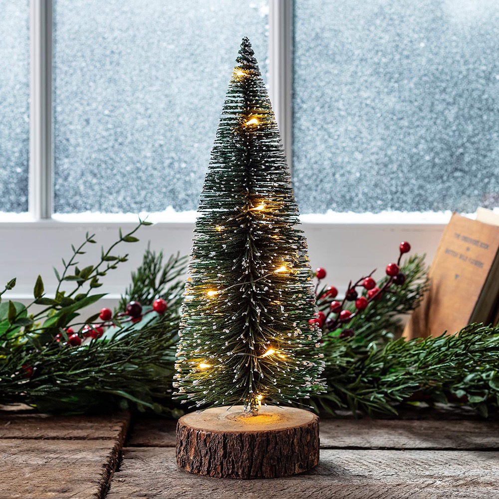 [HCM]Cây Thông Noel lá cước có đèn led màu vàng 25cm