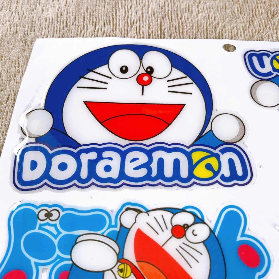 (HCM) TEM PHỦ NHỰA HOẠT HÌNH DOREMON DÁN XE MÁY (MẪU DOREMON CHỮ)
