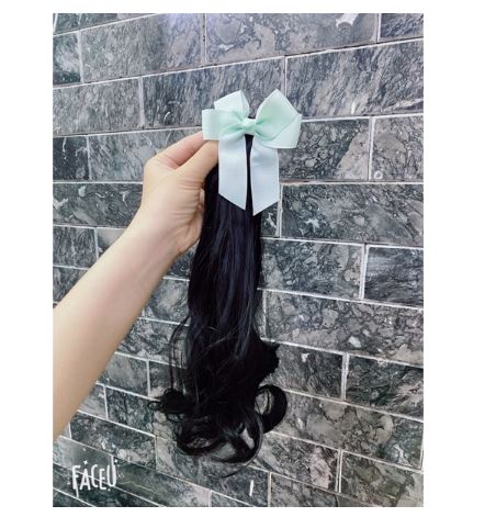 Kẹp tóc nơ xoăn dài cho bé