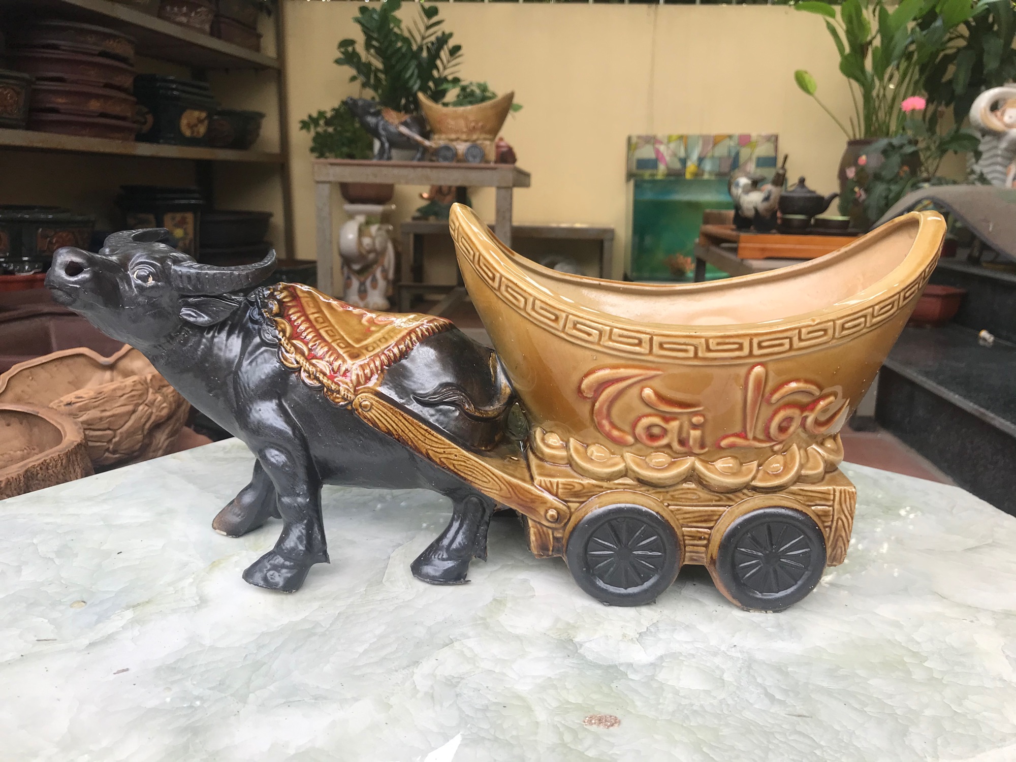 Trâu kéo chậu tài lộc