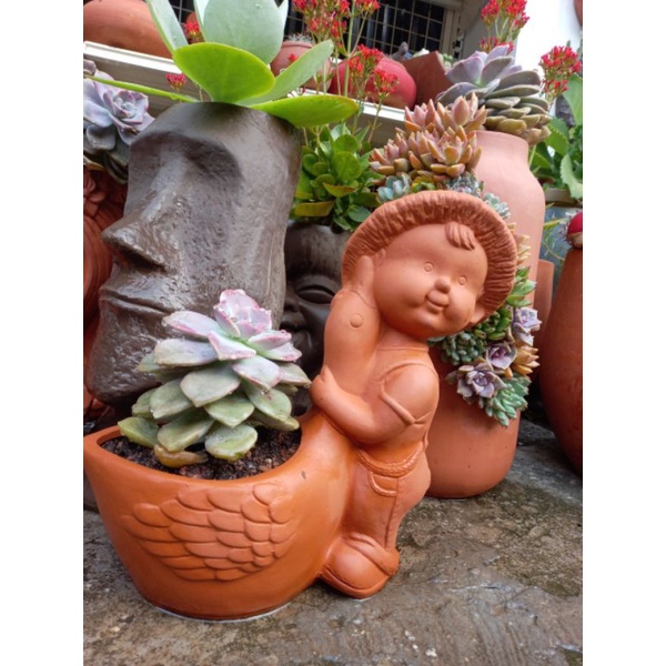 Chậu đất nung hình bé ôm vịt