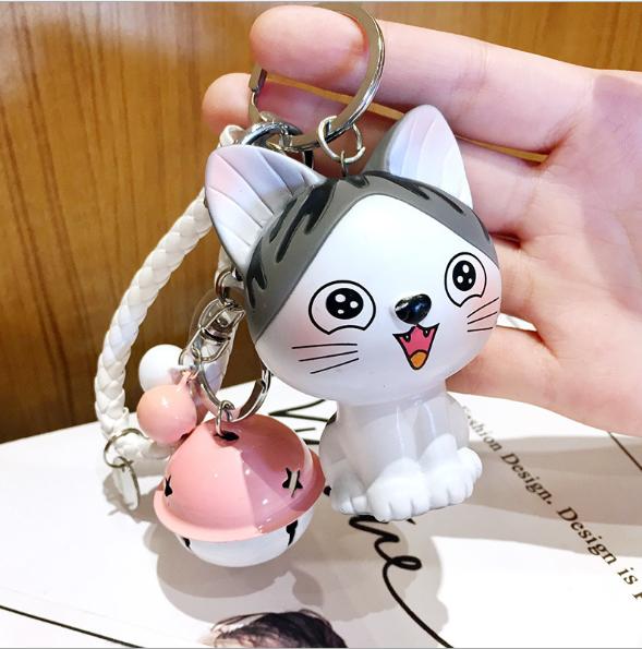 Móc khóa mèo xám cười kèm dây và chuông lớn dễ thương