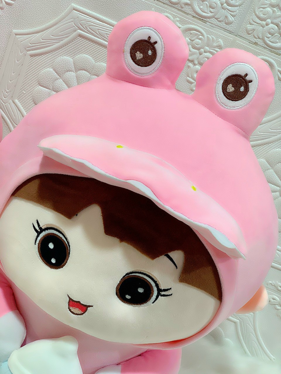 Doll hugging milk tank