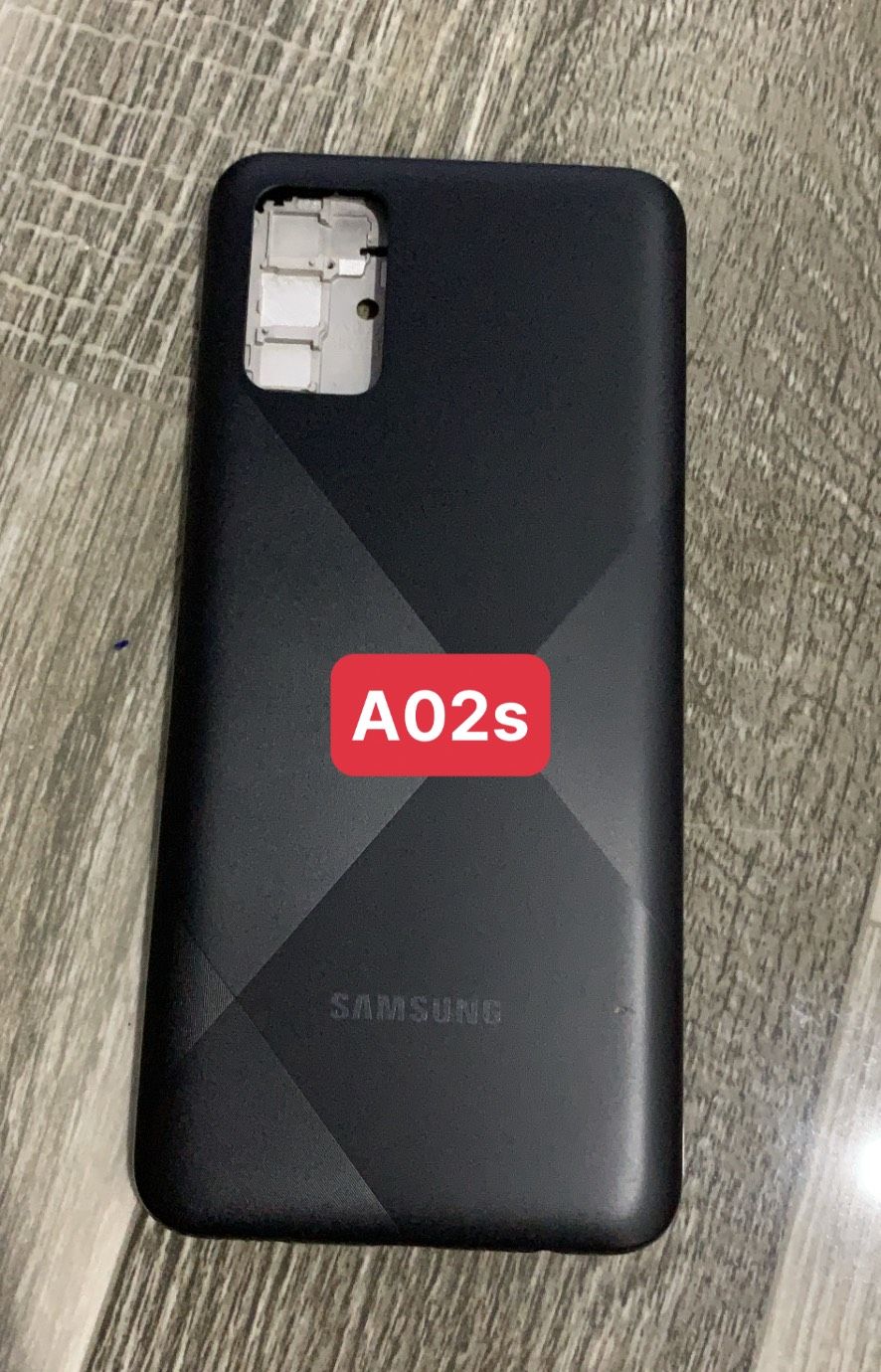 bộ vỏ samsung A02S ( gồm, sườn,lưng,maket, nút bấn)