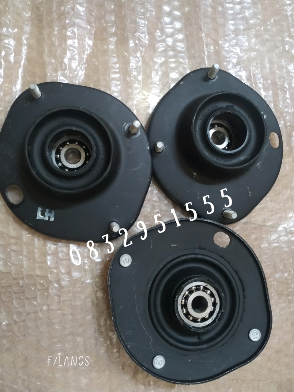 bát bèo giảm xóc trước Lanos