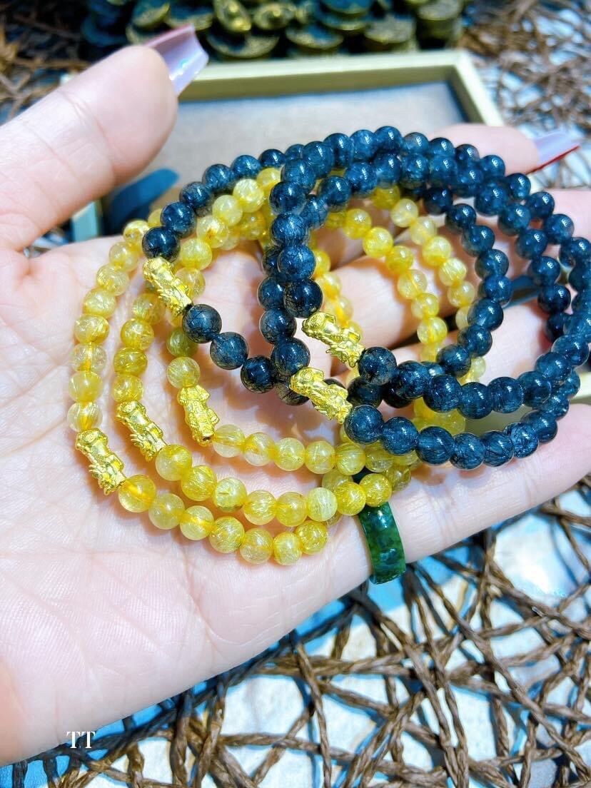 Sale Vòng đá thạch anh tóc vàng _tóc đen mix charm tì hưu vàng 24k