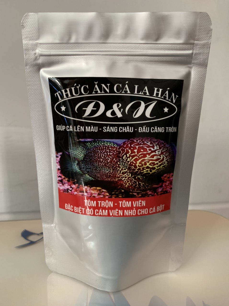 Thức ăn cá la hán - cám la hán đ&n 100gr (hạt Lớn)