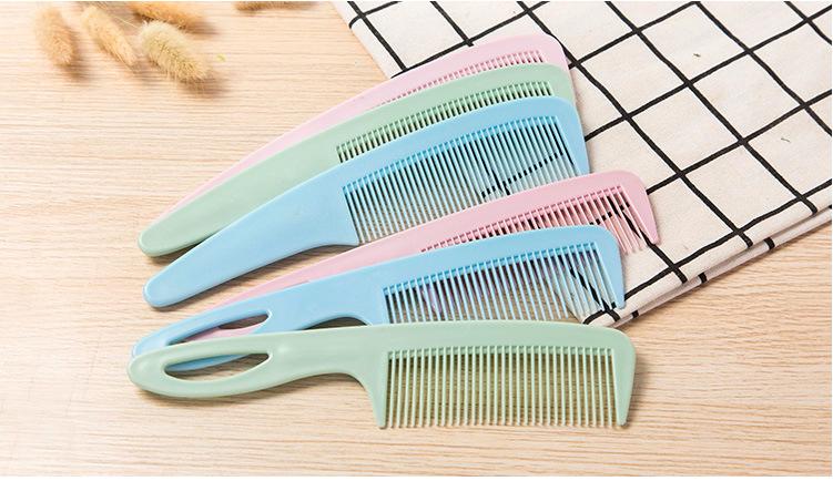Lược tròn chải tóc uốn cán đen