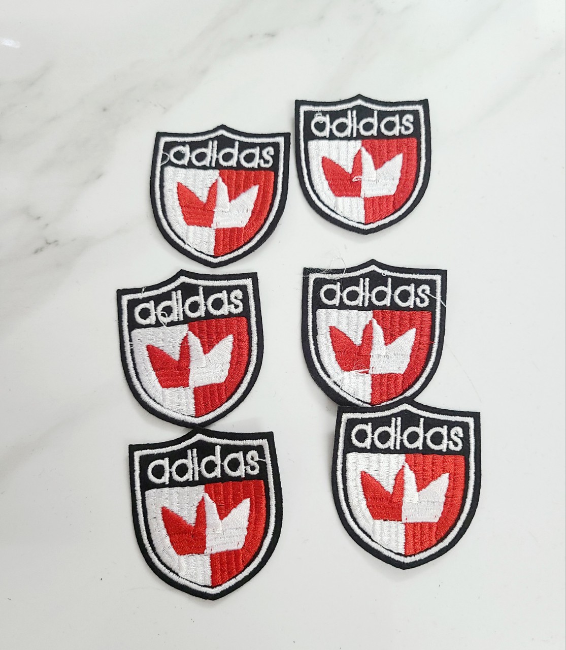 Hình thêu may lên áo trang trí ( logo nhỏ may)