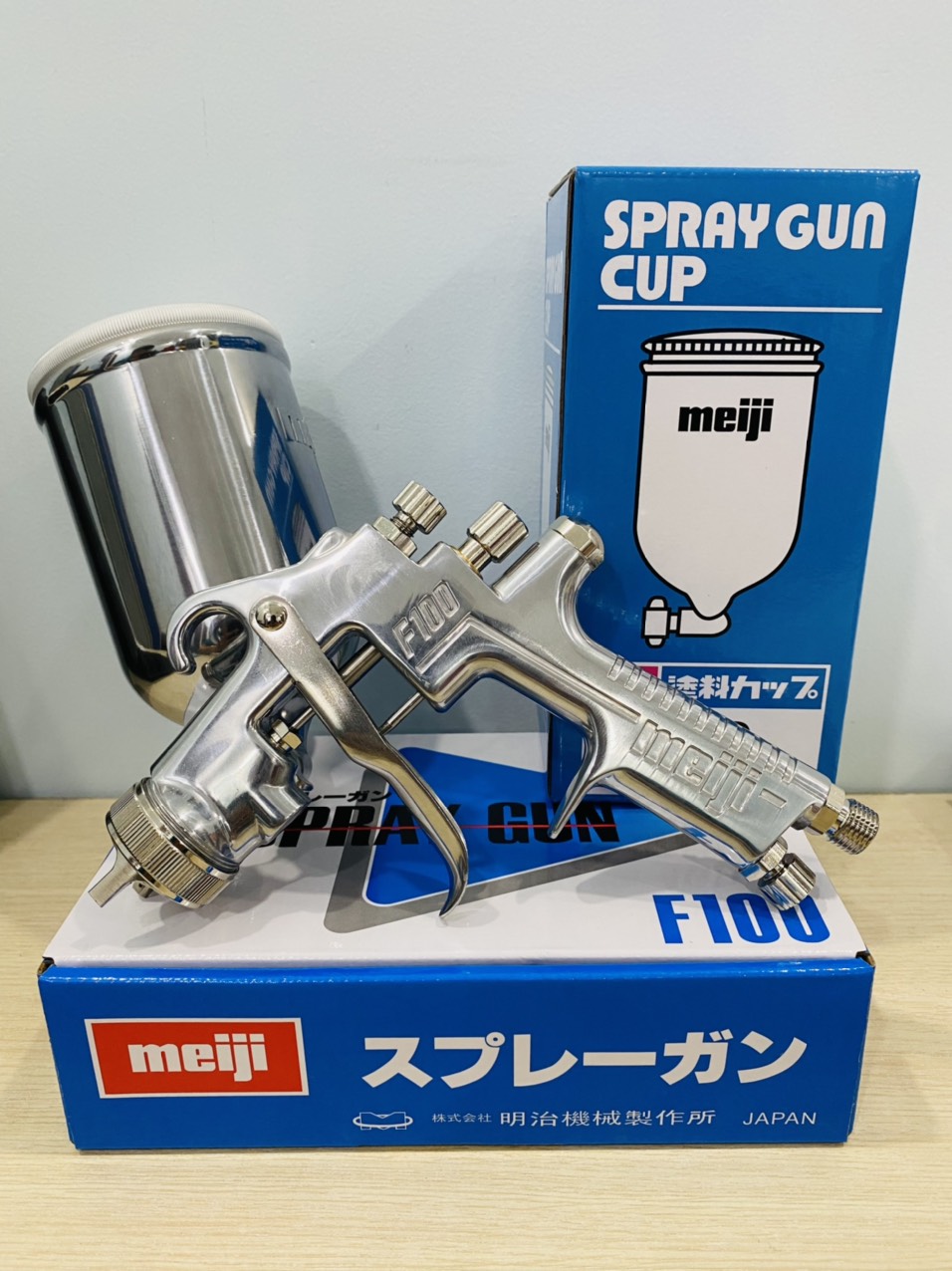 Súng phun sơn Nhật Bản Meiji F100 (Kim béc 1.3mm và 1.5mm, đã gồm cốc đựng sơn 400ml 4GD)