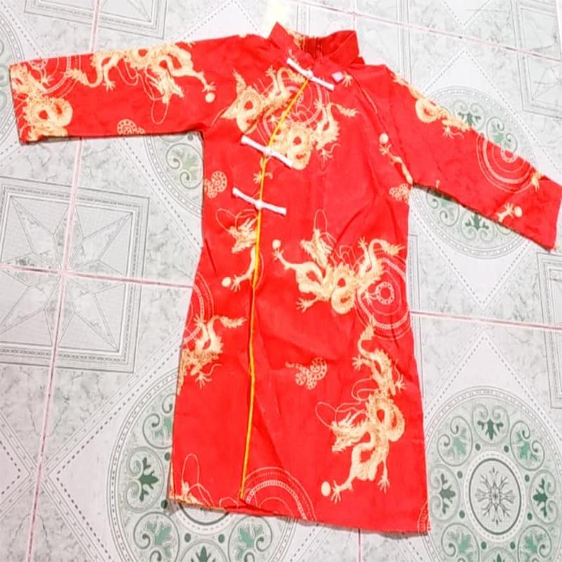 Áo dài cách tân cho bé trai chơi tết