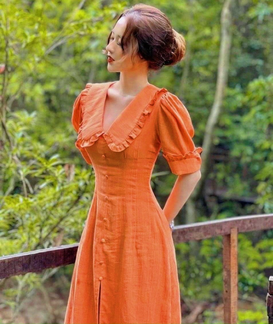 Đầm cam cổ bèo nút bọc