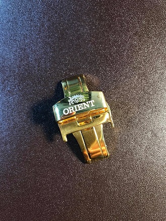 Khóa bướm khắc logo Orient