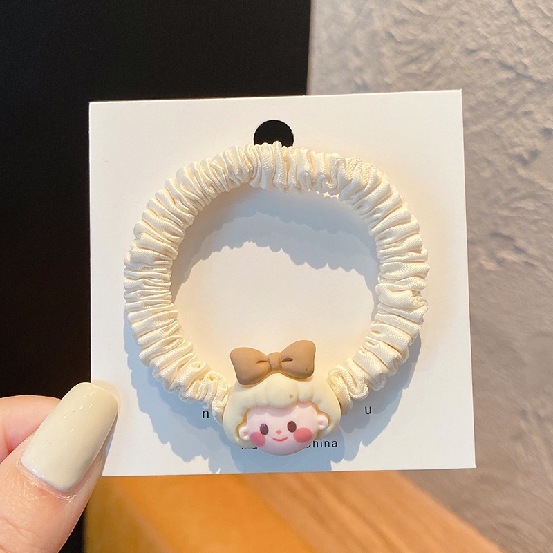 Scrunchies dây cột tóc cô gái nhỏ xinh xắn