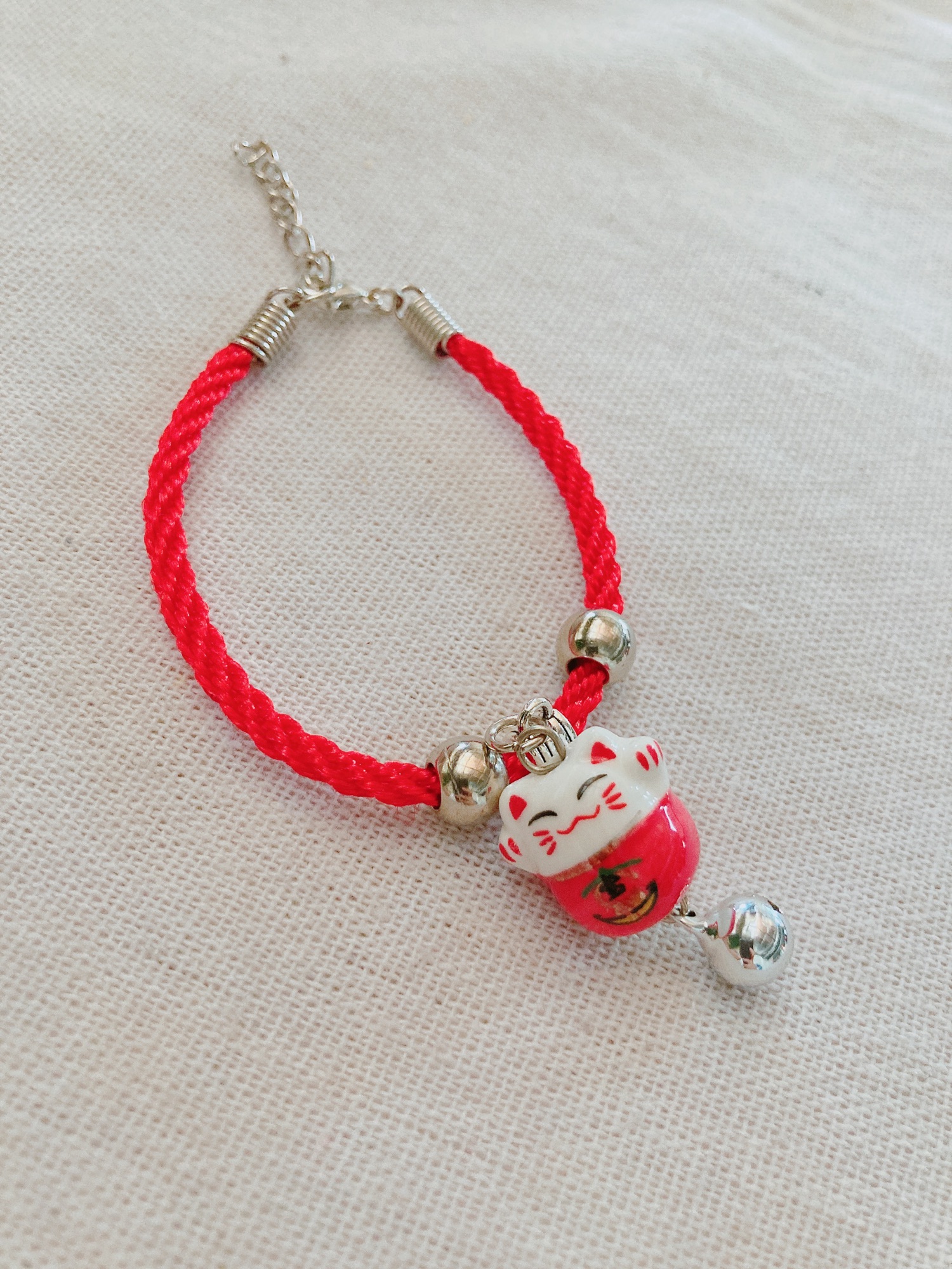 Vòng tay mèo maneki neko gốm sứ