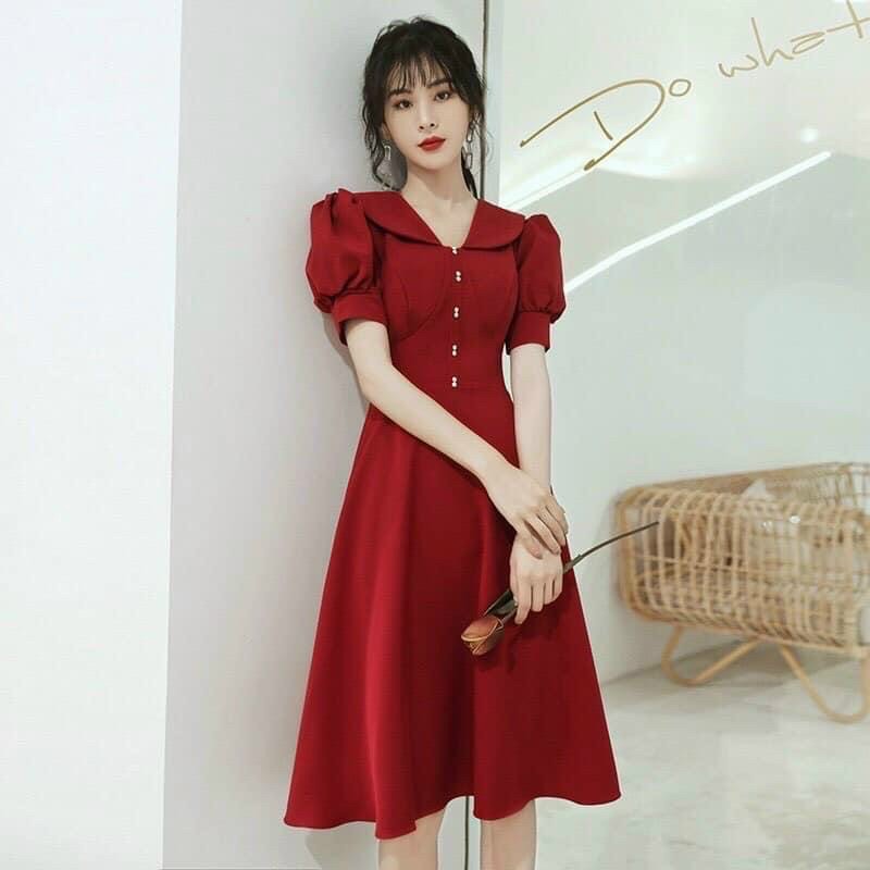 Đầm xanh rêu nút nhí