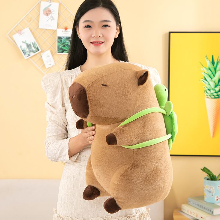 Đồ chơi Chuột Capybara đeo túi Rùa size lớn, Gấu bông Chuột lang nước nâu, gấu bông Capy bara mẫu mới hot trend
