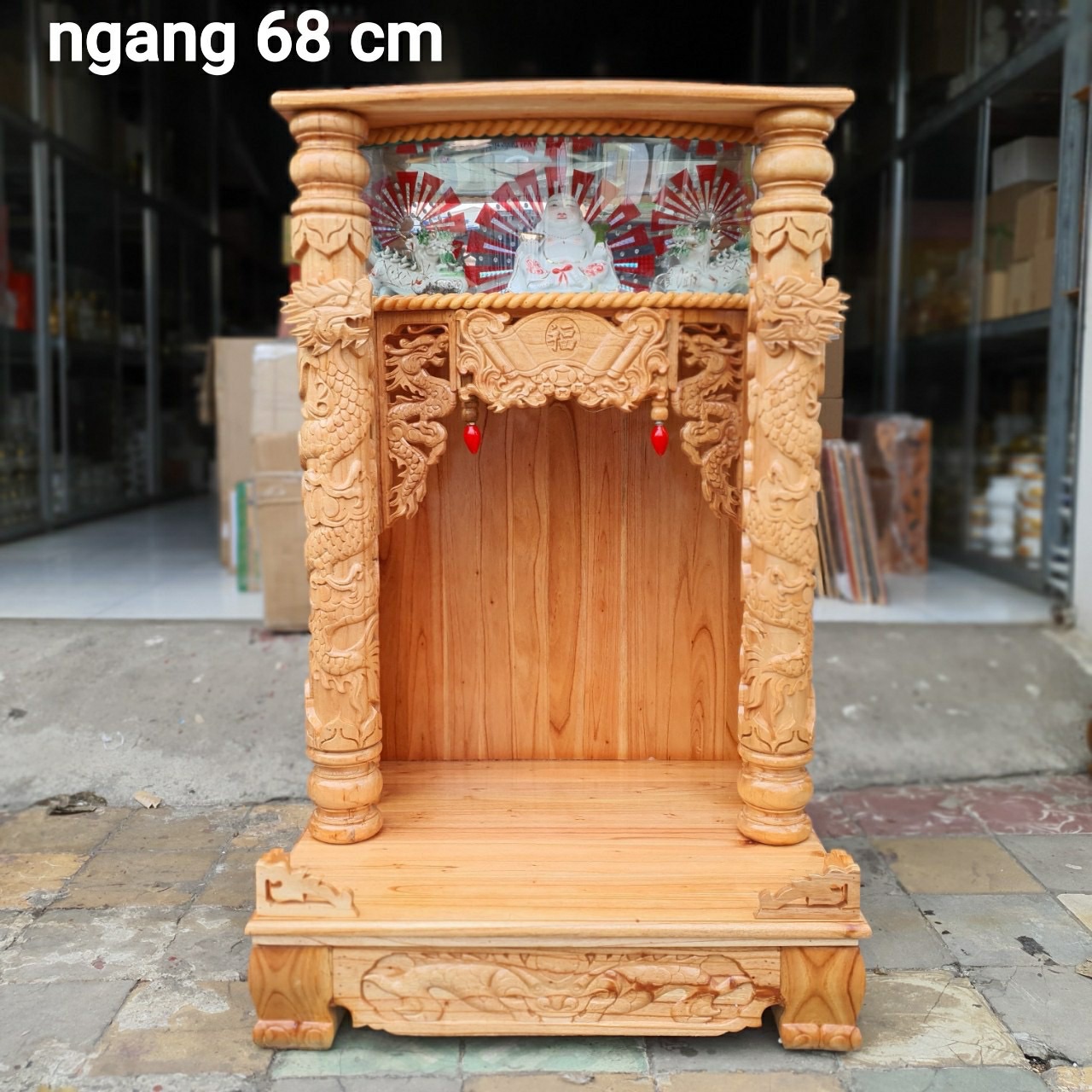 Bàn thờ thần tài ông địa gỗ xoan ngang 68 cm quỳ trụ điện tử mẫu đẹp