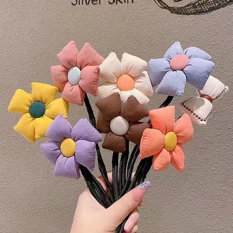 Cột tóc, búi tóc cho bé gái hình bông hoa