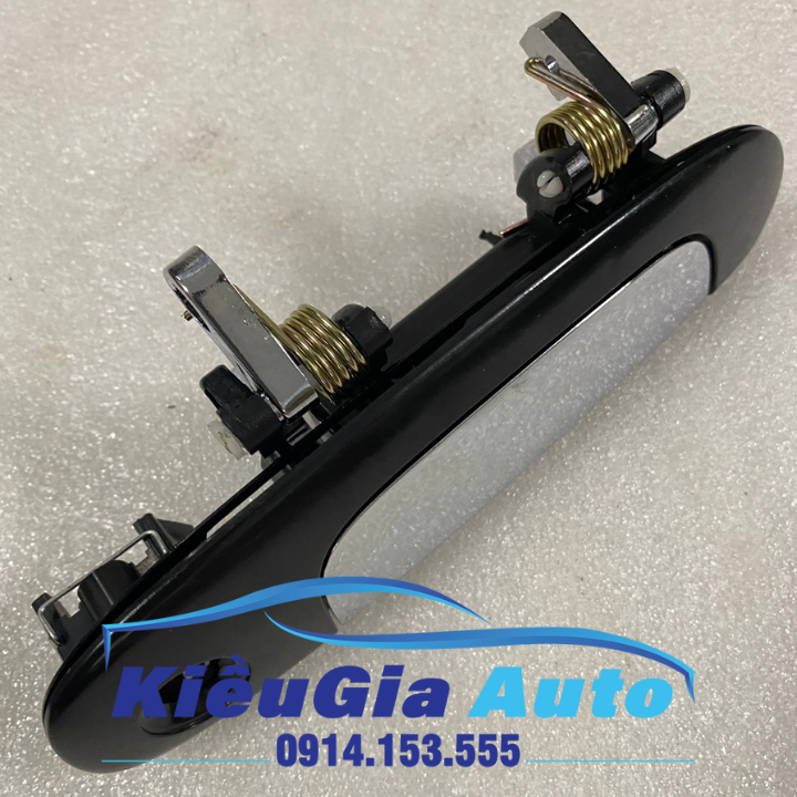 Tay mở cửa ngoài Ford Laser