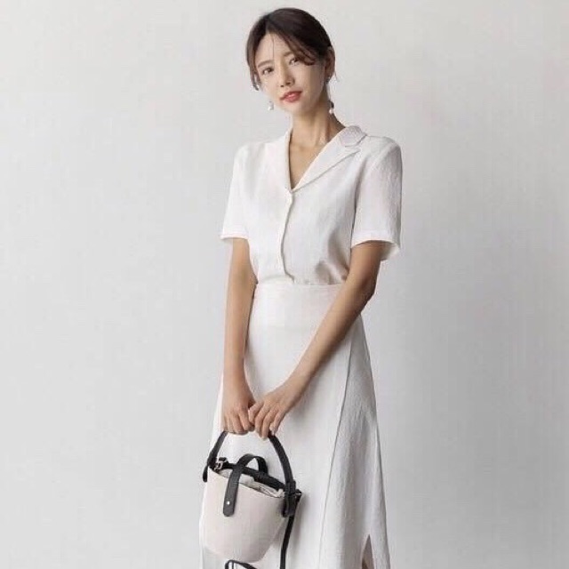 Đầm trắng cổ vest đắp tà