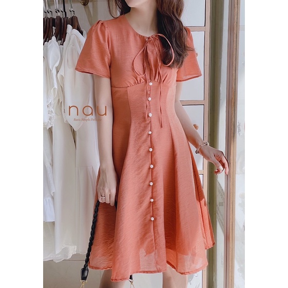 Đầm phối nút ngọc dáng xoè nhẹ cột nơ cổ