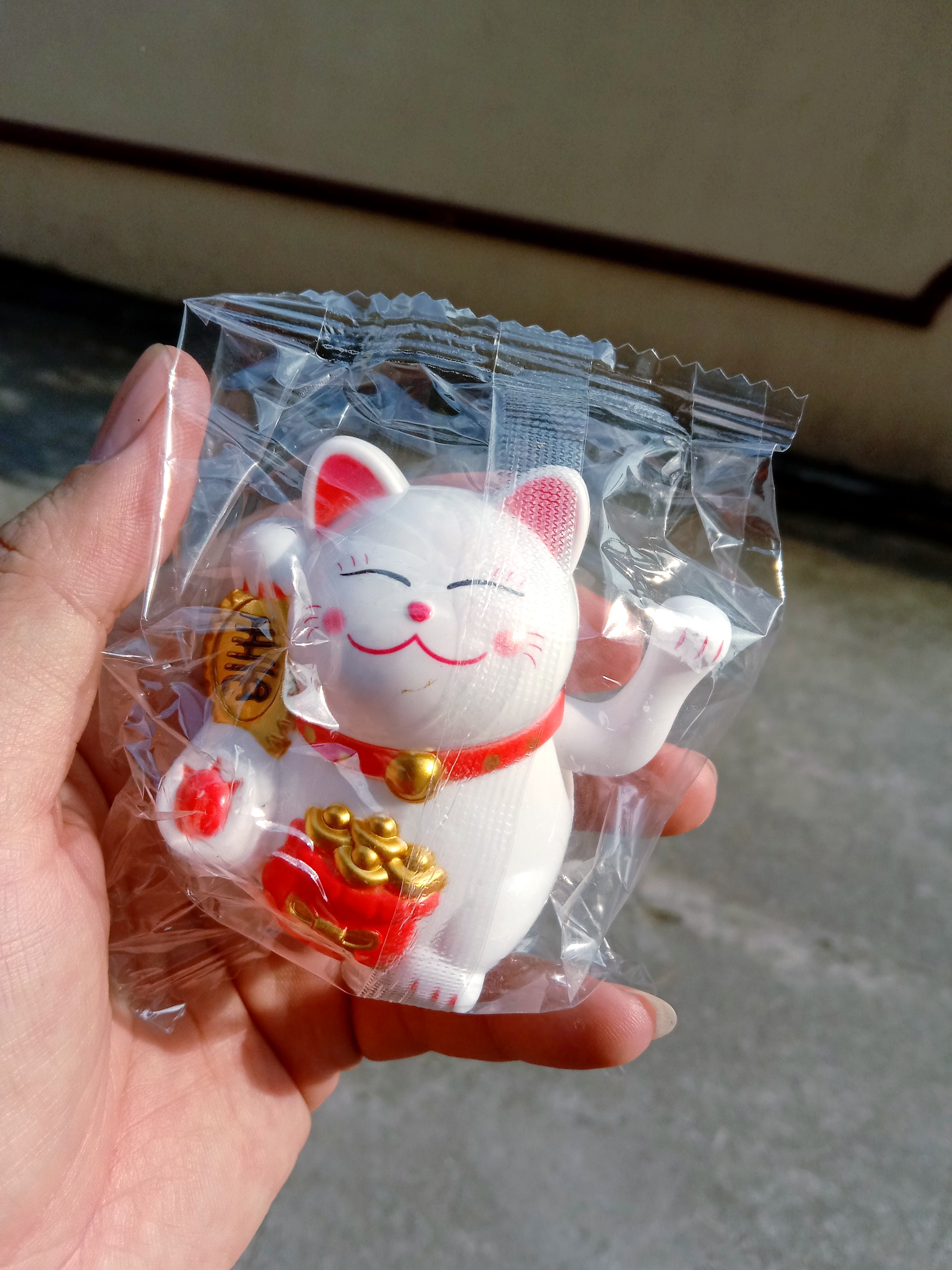 mèo may mắn, thần tài