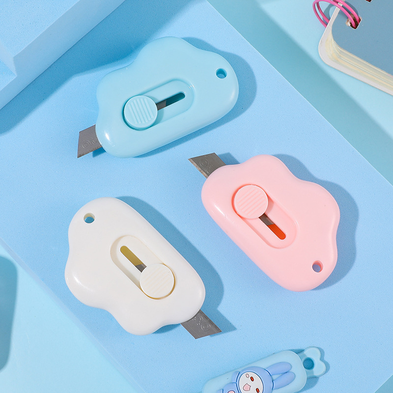 Cute and compact cloud-shaped paper cutter with self-retracting blade, safe and convenient