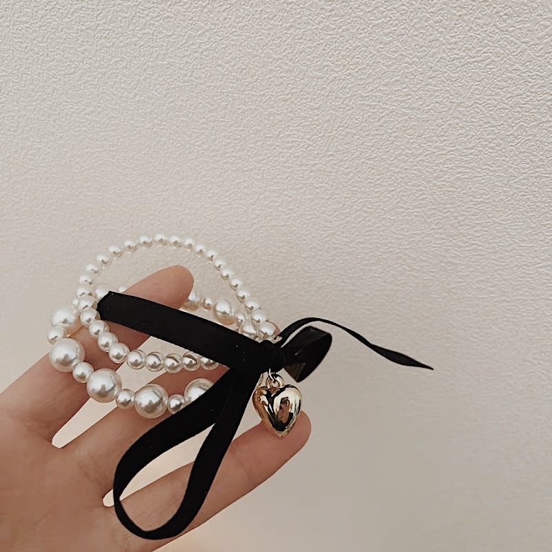 Cột tóc dạng chuỗi hạt ngọc trai phối nơ phong cách tiểu thư