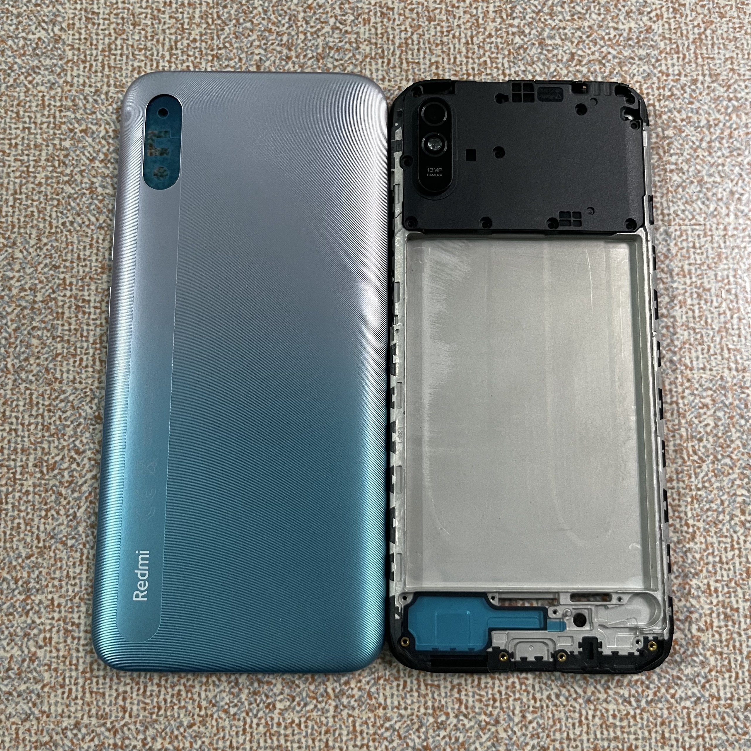 Bộ vỏ redmi 9a gồn sườn,lưng.kính cam,nút bấn, có cả khay sim)