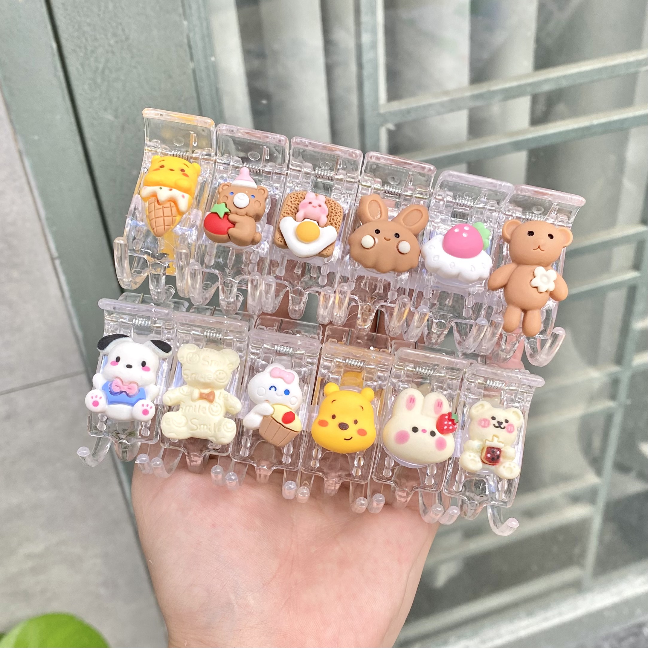 Sỉ lố 12 kẹp càng cua gắn icon hoạt hình mix