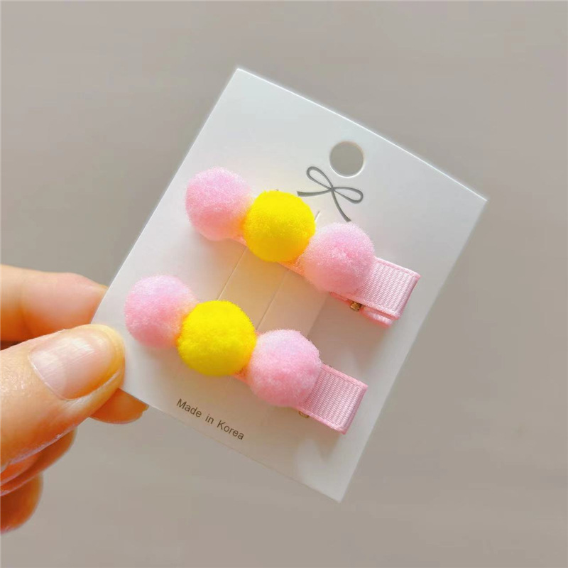 set 2 kẹp tóc pon pon cho bé .