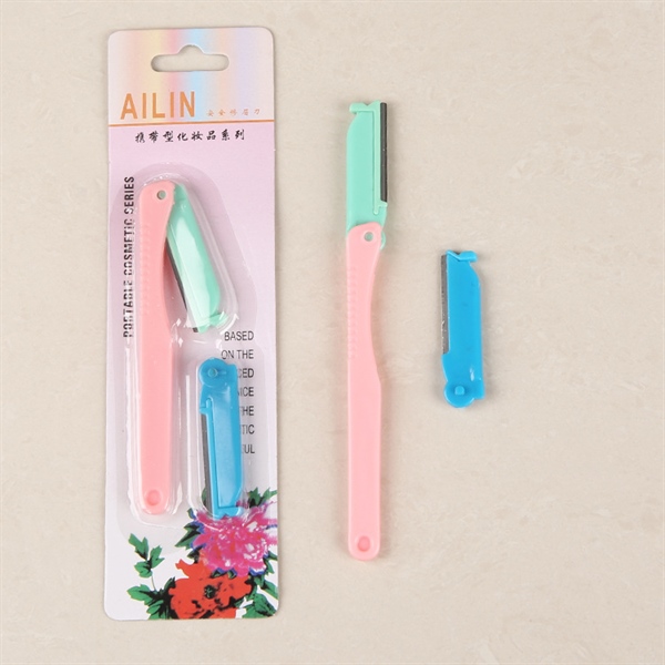 Utility mini eyebrow trimmer with replacement blades