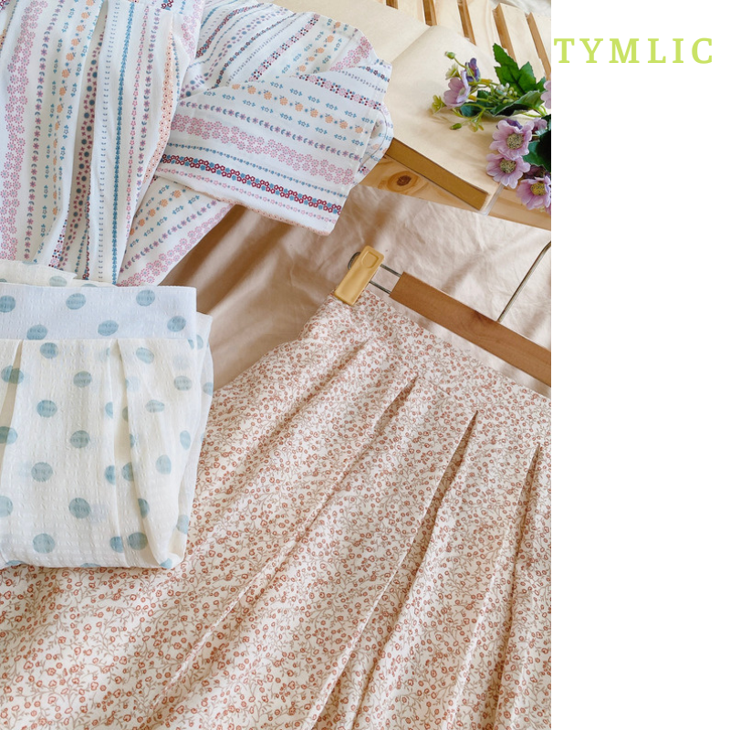 Chân váy midi họa tiết xếp ly TYMLIC