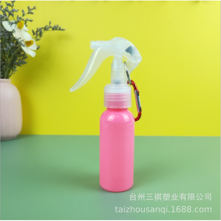 Compact 60ml water bottle with integrated keychain for hand sanitizer.