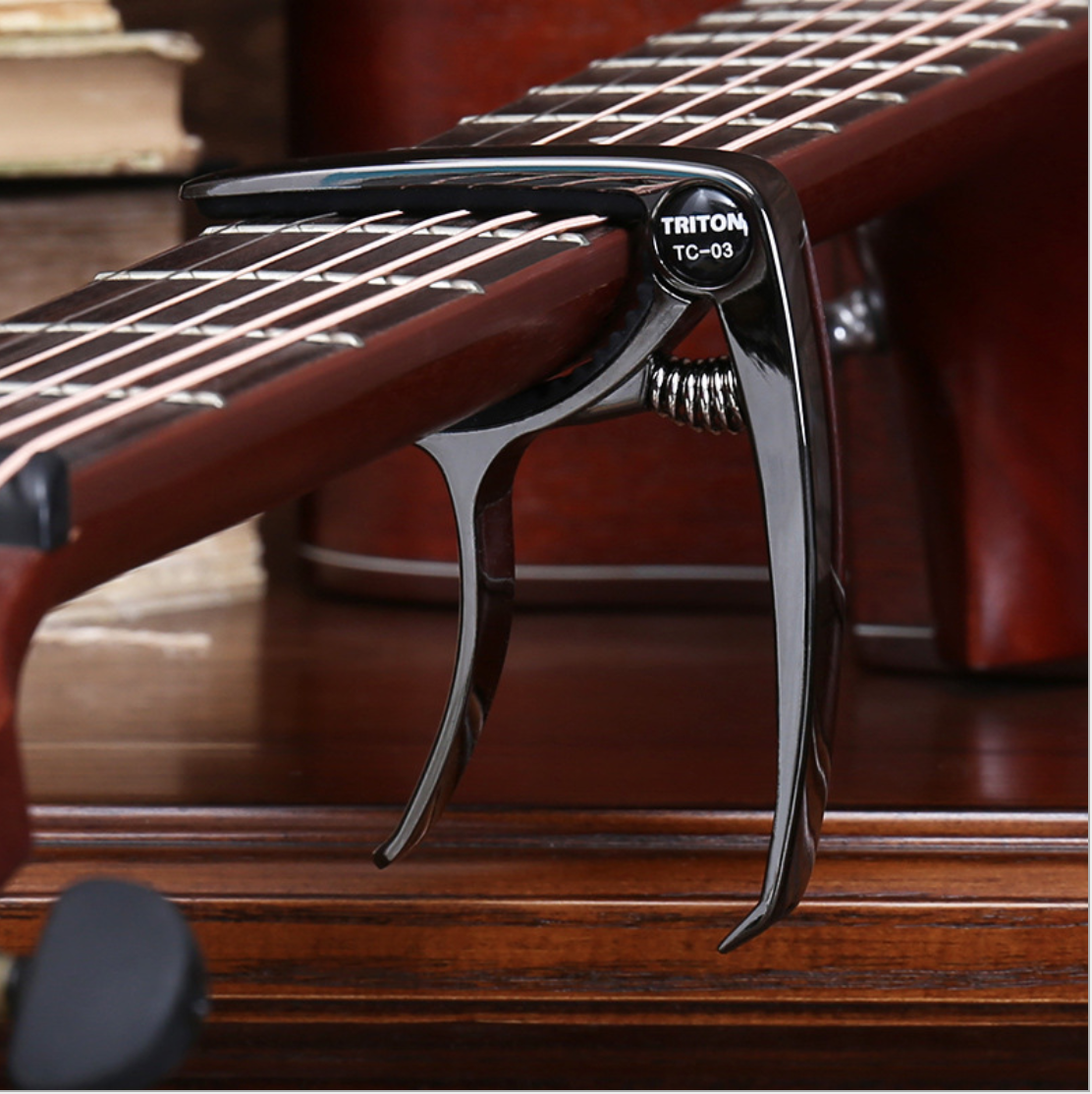 Capo Đàn Guitar/Ukulele Vân Gỗ TC-03.