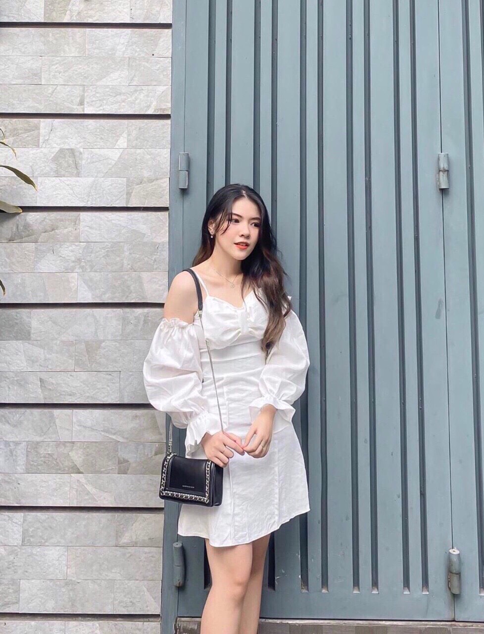 Đầm hai dây nơ ngực tay dài phồng
