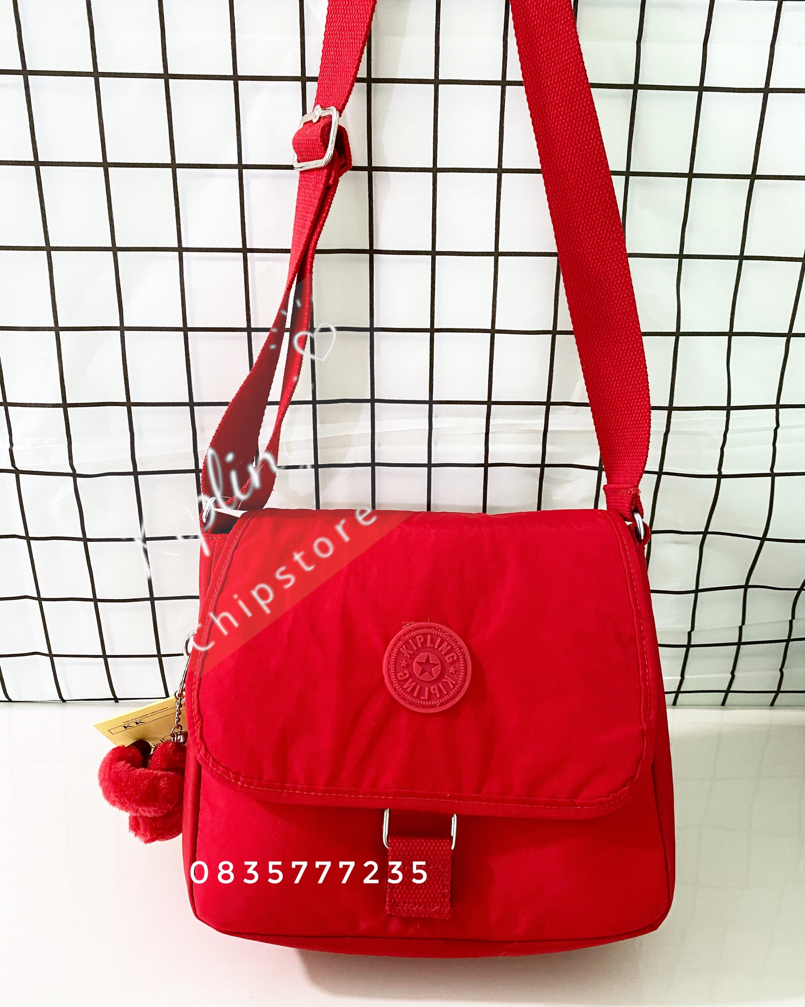 Túi đeo chéo nắp gập Kipling