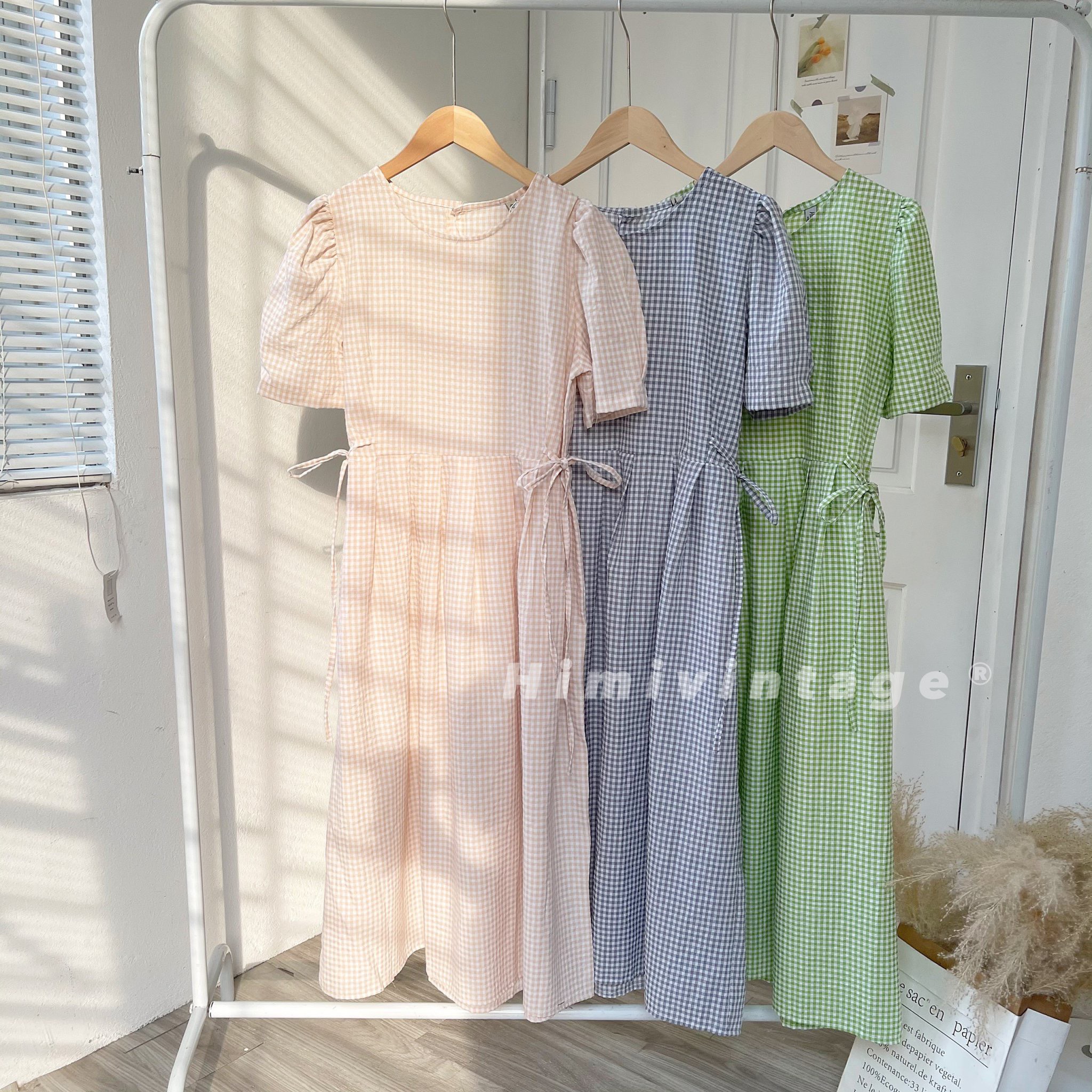 Đầm caro babydoll dây thắt nơ eo